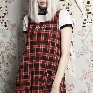 Disturbing "Awkward" red plaid jumper dress